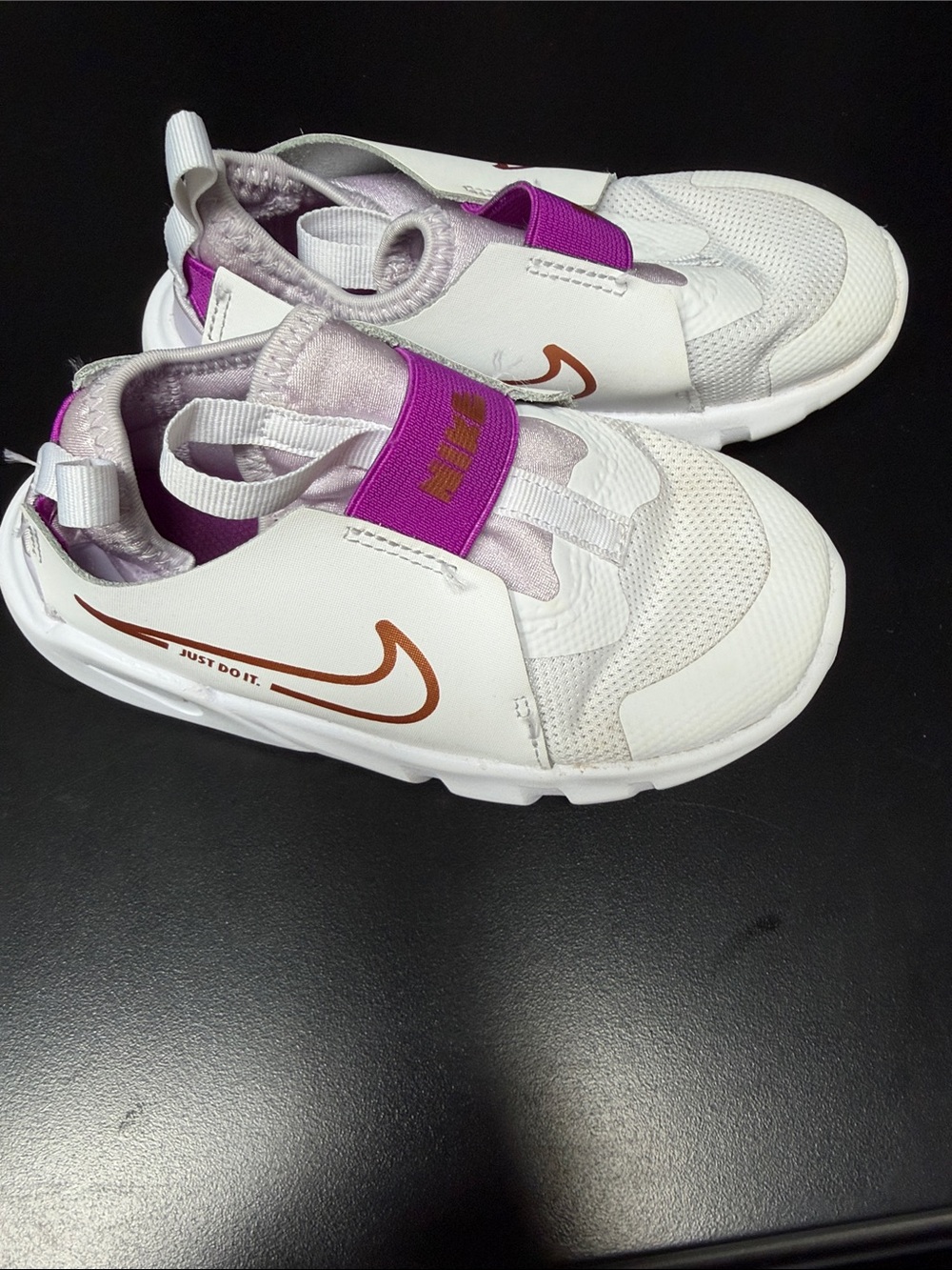Nike Kids White Slip-On Sneakers with Purple Strap and Copper Swoosh